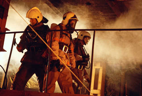 shutterstock_44110936 (1).jpg Firefighters in protective gear navigating through smoke