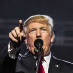 Donald Trump speaking passionately at a rally