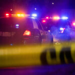 Fired Taco Bell Worker KILLS Manager Police cars with flashing lights behind caution tape