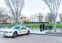 Afghan Shooter Near White House Sparks Vetting Outrage Police car and officers in front of large building