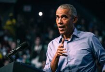Fugees Rapper’s Shocking 14-Year Sentence: Obama Donations A speaker gesturing while addressing an audience