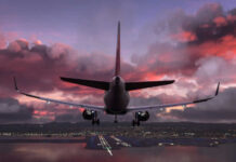 MH370 Search REIGNITED: Could This Be It? Airplane approaching airport runway at sunset sky