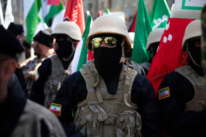 Soldiers in formation with flags and helmets visible