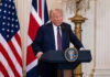 Trump Accounts’ SHOCKING $75M Boost Man speaking at podium with USA and UK flags