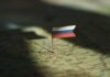 Russia’s Nuclear Gamble — Shocking Bitcoin Plan A small Russian flag pinned on a map