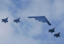 F-15EX Payload Stuns – Outclasses F-35! Five military aircraft flying in formation under clouds